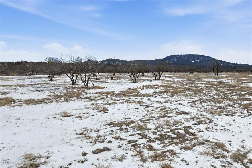 Located in the highly desirable Jim Ned School District, this 69 acre property offers an exceptional opportunity to build your dream home in a scenic and private setting. The land features a beautiful building site with panoramic views of the surrounding hills and countryside. A stocked tank provides fishing for bass, perch, and stocked with minnows, and the property supports abundant wildlife including whitetail deer, hogs, and other varmints, making it ideal for recreational use and hunting. With a balance of open space and natural terrain, this tract is well suited for residential, agricultural, or recreational purposes. A rare opportunity to own acreage with both beauty and functionality in a sought after location.