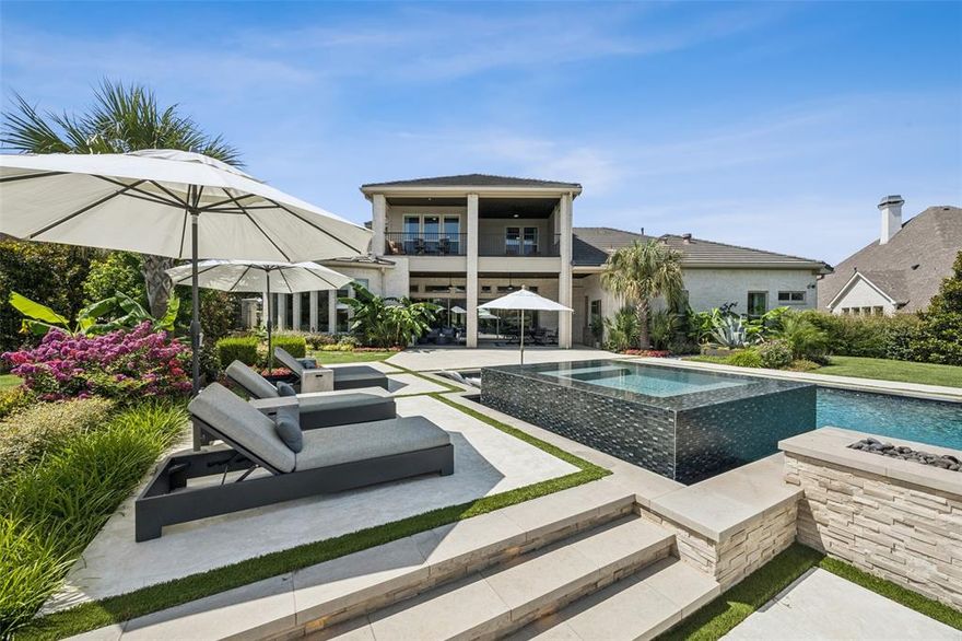 Welcome to a modern retreat at 921 Hampton Manor Way, where luxury meets relaxation in this stunning 6-bedroom home. Yes, you can have it all—this property is designed for all-season enjoyment. Dive into summer days by the award-winning Claffey pool, unwind in the hot tub on crisp winter evenings, or host unforgettable barbecues in the outdoor living space.  Inside, this home is a haven of comfort and style, boasting over $400k in upgrades. The media room and game room with a wet bar and balcony offer endless entertainment options. Five of the six spacious bedrooms feature private baths, ensuring privacy and convenience for family and guests.  The heart of the home is the gourmet kitchen, equipped with top-of-the-line Wolf SubZero appliances, Bosch dishwashers, a prep kitchen with a sink, and elegant Waterstone fixtures. A wine enthusiast's dream, the property includes two wine fridges and a custom wine cellar. Practicality meets luxury with solid core wood doors, motorized window shades  in the study and primary bedroom, and a dual tankless hot water system with recirculation pump. The four-car garage features epoxy floors. Sliding patio doors open to a dining area with gas fireplace and drop screens for an idyllic, bug free setting. Come and experience refined living at its best!