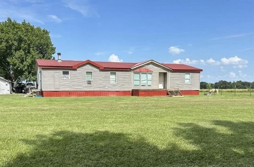 Just added - New vinyl siding. Large Mobile Home on 1.45 unrestricted acres with an addtional apartment with water, sewer and electric. 200 feet of new lateral lines installed on the septic system. Crossroads ISD.