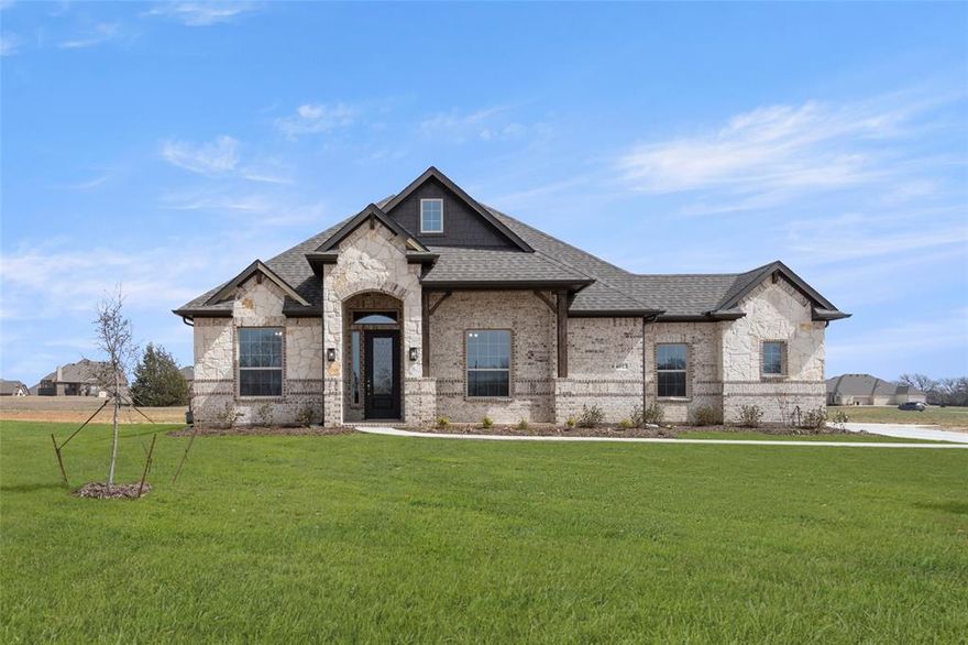 Elegant and inviting, this beautifully crafted Sandlin Nottingham Plan in the sought-after Joshua Meadows community blends modern comfort with timeless charm. Thoughtfully designed for today’s lifestyle, this home offers 3 spacious bedrooms, 2.5 bathrooms, a private study, and formal dining, creating a layout that lives larger than many traditional 4-bedroom homes. The open-concept design prioritizes usable living space, functionality, and flow, offering both privacy and openness in all the right places. The heart of the home is the gourmet kitchen, showcasing quartz countertops, a large center island, painted cabinets, a custom wood vent hood, and a rare double pantry delivering exceptional storage and everyday convenience. The owner’s suite is a true retreat, featuring bay windows, a tray ceiling, and a spa-like ensuite bath designed for relaxation. Additional highlights include upgraded lighting throughout, elegant finishes, and a 3-car garage with connected outdoor storage space, providing even more room for organization and flexibility. Step outside to enjoy the expansive oversized patio, perfect for entertaining or unwinding with a gas drop ready for your grill. The spacious backyard offers endless possibilities, whether you envision a pool, shop, garden, or outdoor kitchen. Set on a generous homesite within Joshua Meadows and served by highly rated Joshua ISD, this home offers the perfect blend of space, comfort, and versatility ideal for buyers who value how a home lives over bedroom count.