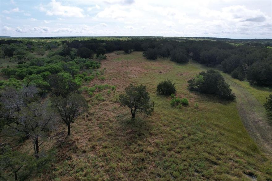Five beautiful and secluded acres at the magnificent Hills Above Possum Kingdom. Property extends back to the adjoining ranch so there are no backyard neighbors. Property has been cleared but has plenty of trees and brush for cover for the various forms of wildlife you will enjoy watching. Property is level with many places on it that would make a great homesite. Lot is large enough to have horses or cattle, with limitations. You may have an oversized shop on this lot. Lot ownership permits the use of all of the neighborhood amenities including; clubhouse with pool and fitness center, boat storage, boat ramp, community dock, cabin with picnic area and covered patio, lakefront area, fishing pond, walking trail, and twenty miles of private roads behind the gates.