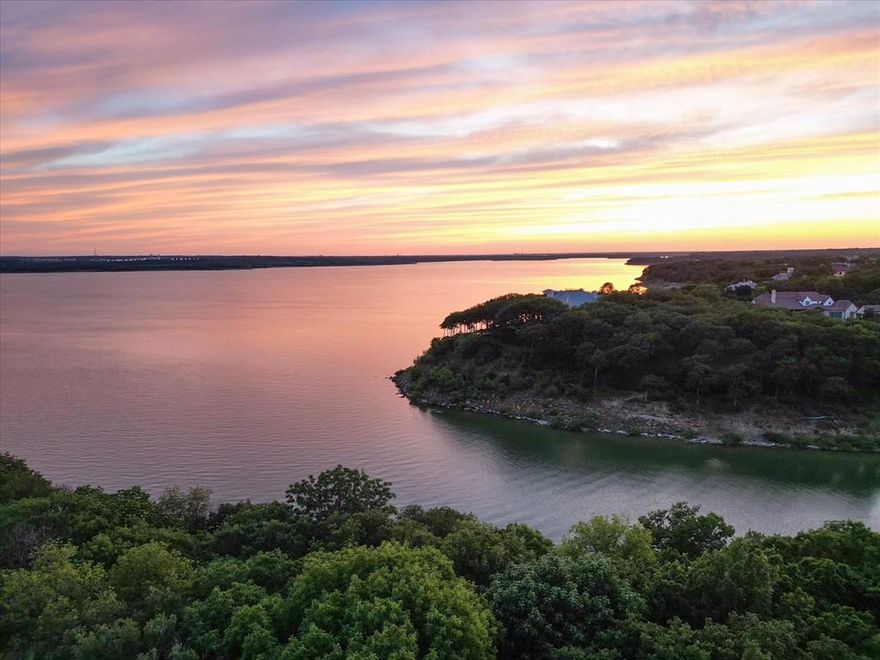 This East Facing home is more beautiful in person than any photos. The pristine resort living found here is true luxury living. This breathtaking waterfront property is stunning. Sitting on over one acre of immaculate land, this stunning estate boasts 4 living areas, 4 bedrooms, 5 full bathrooms, and 1 half bathroom, 4 car garage, and an air conditioned separate retreat for your pets and more. The property is a haven for relaxation and entertainment, offering a pool, spa, fitness room, media room, billiards room, cedar closet, and more. The gas cooking chef's kitchen is a culinary masterpiece, perfect for hosting lavish dinner parties. Enjoy stunning sunset views from the backyard, providing the perfect ambiance for unwinding and socializing with family and friends. This remarkable estate blends natural beauty and unparalleled amenities, providing an unrivaled living experience. Don't miss the chance to make this luxury property your own and experience the pinnacle of refined living.