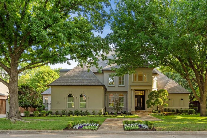 Set within Southlake’s only guarded and gated community, this remodeled and meticulously maintained home in Monticello Estates blends timeless architecture with modern updates and a serene natural backdrop. A dramatic two-story entrance welcomes you into elegant formal spaces bathed in natural light and grounded by beautiful hardwood floors and staircase.
The fully remodeled kitchen is the heart of the home, designed for daily comfort and large-scale entertaining. It features an oversized quartzite island, illuminated glass cabinetry, and top-tier appliances including a 60-inch Wolf dual fuel range, Wolf Steam Oven, built-in Sub-Zero fridge-freezer, SubZero 144 bottle dual zone wine fridge, 2 Miele Dishwashers & Sharp Drawer Microwave. The kitchen opens seamlessly into the spacious family room, creating an ideal setting for hosting gatherings or casual get-togethers.
Large panoramic windows frame tranquil views of the trees from nearly every room, connecting each space to nature. The shaded walking trail behind the property winds directly to Monticello’s private tennis and pickleball court, blending recreation and relaxation.
The 1st floor primary suite offers tall windows, a cozy fireplace, and peaceful outdoor views, while the guest suite down provides ideal privacy for visitors. A versatile 1st floor bonus room adds flexibility for a 2nd office, fitness studio, or craft room. Upstairs, movie and game nights come to life in the media and game rooms.
Step outdoors to the inviting covered living area with built-in grill, perfect for year-round entertaining beside the sparkling diving pool. The freshly painted exterior enhances the home’s timeless curb appeal and low-maintenance charm.
This beautifully updated Monticello Estates residence delivers luxury, space, and setting—an unmatched combination in Southlake’s premier guarded and gated community. Peruse the long list of updates including exterior paint 2026, remodeled kitchen 2023 & Class IV roof 2020.