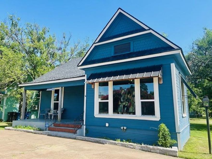 HOLIDAY SPECIAL:  $1200 A MONTH FOR THE FIRST THREE MONTHS OF THE NEW YEAR!  Then rate will be $1500 for the remainder of the year for this beautiful office space featuring a welcoming front porch. Upon entering the reception area, you are greeted by two spacious rooms on either side, bathed in natural light from large windows. With ample storage space, a cubby suitable for a private office, and a modernized restroom, this professional environment is perfect for hosting clients. As an art gallery, it boasts excellent lighting and tasteful wall colors. Elevate your business to Historic Main Street in Denison, TX, one of North America's most charming cities.