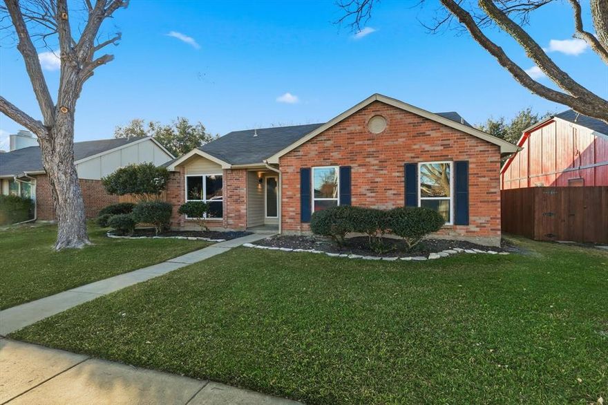 Welcome to this move-in-ready 3-bedroom, 2-bath home in the heart of The Colony, offering a bright, open floor plan and stylish modern updates throughout. Recent upgrades include luxury vinyl plank flooring, All New Windows, fresh interior paint, updated lighting, and backyard privacy fence. The spacious living room is filled with natural light and anchored by a cozy brick wood-burning fireplace, creating a warm and inviting space for everyday living and entertaining. The kitchen features granite countertops, tile flooring, and ample cabinet space for both function and style.
The split-bedroom layout provides privacy and flexibility, with a generous primary suite featuring an updated en-suite bath with new double sink vanity, lighting, and modern fixtures. Secondary bedrooms are a great size and the hall bath has been refreshed with updated vanity, lighting, and fixtures. Step outside to a private backyard and cozy patio—perfect for relaxing, gardening, or weekend barbecues. No HOA. Located within walking distance to Ethridge Elementary and Lakeview Middle School and just minutes from Stewart Creek Park & Boat Ramp, Stewart Peninsula Golf Course, Shoreline Trail, Friendship Park, Scout Park, Pawsome Dog Park, and The Colony Aquatic Park. Enjoy quick access to Grandscape, Topgolf, Stonebriar Mall, The Star, Legacy West, Hwy 121, Dallas North Tollway, George Bush Tollway, and DFW Airport. Clean, updated, and truly turnkey—this home is ideal for a first-time buyer or a smart investment opportunity.