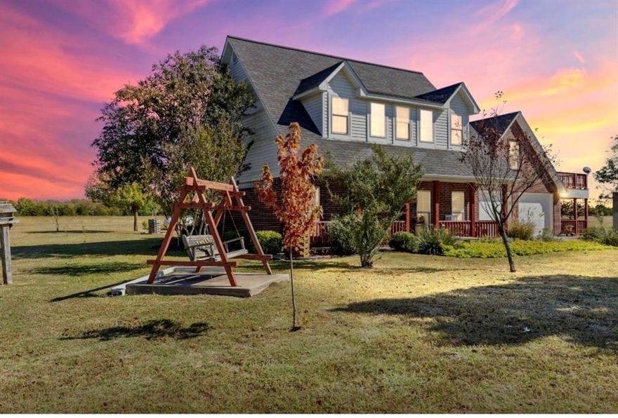 Seller is retiring and building his forever home in Arkansas, very motivated to sell!!  Enjoy the beauty of Country Living in this custom built, two-story Brick home.  Nestled on 12 peaceful Acres, this Property offers 2,752 sq ft of well-designed Living Space with 4 Bedrooms, 3.5 baths, and a 640 sq ft private In-Law Suite with full bath, a small dining area and a large. A welcoming front Porch leads into a spacious Living Area featuring a Gas Log Fireplace, Rich Wood Flooring, Crown Molding, and Nickel Gap Accents.  The updated Kitchen is a Chef's Dream with Granite Countertops, Bosch Dishwasher, Samsung Propane Range, GE Convection Microwave with Air-Fryer, and plenty of Pantry Storage.  The Main-Level Primary Suite features a Granite Double Vanity, Jetted Soaking Tub, Walk-In Shower, and a generous Walk-In Closet.  Upstairs you'll find two Guest Bedrooms with Oversized Closets and a shared Bath.  The mother-in-law suite offers a full Bath with Rain Shower and Skylight, a small dining area, an upper deck that is exclusive and private from main living area, and a Separate Entrance-perfect for Guests, Extended Family, or Rental Income.  Additional Highlights include a Home Office with Cathedral Ceiling and French Doors leading to a covered porch., Laundry Room with Cabinetry and Shelving, and Dual Pantries.  Outdoor Living Shines with three Covered Porches, a 75x40 Shop with a 3-Car Carport and Concrete Floor, two Storage Sheds with Porches, a Hot Tub, Raised Garden Beds, Mature Landscaping, Fruit and Flowering Trees, a pond with Dock, and Fenced Areas for Pets or Livestock with Frost-Free Hydrant, RV Hookup and a Propane Tank. Energy efficient 5-Ton, 2 Zone Heat Pump.  Conveniently located 15 Minutes from Leonard and Bonham, and 20 Minutes from Bois D'Arc and Ralph Hall Lakes.  11 acres Ag Exempt, and Move-In Ready-Furnishings Negotiable for Turnkey Option.