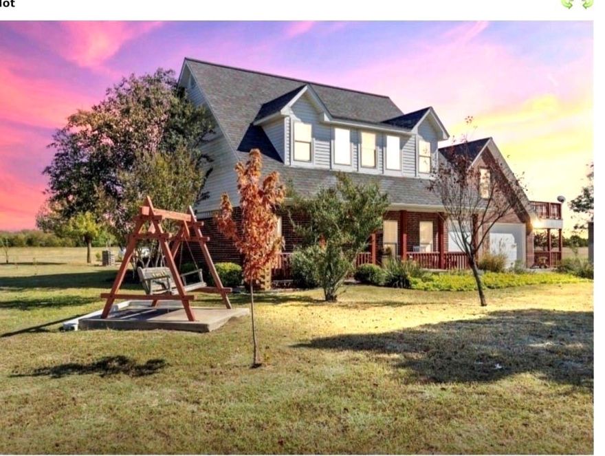 Seller is retiring and building his forever home in Arkansas, very motivated to sell!!  Enjoy the beauty of Country Living in this custom built, two-story Brick home.  Nestled on 12 peaceful Acres, this Property offers 2,752 sq ft of well-designed Living Space with 4 Bedrooms, 3.5 baths, and a 640 sq ft private In-Law Suite with full bath, a small dining area and a large. A welcoming front Porch leads into a spacious Living Area featuring a Gas Log Fireplace, Rich Wood Flooring, Crown Molding, and Nickel Gap Accents.  The updated Kitchen is a Chef's Dream with Granite Countertops, Bosch Dishwasher, Samsung Propane Range, GE Convection Microwave with Air-Fryer, and plenty of Pantry Storage.  The Main-Level Primary Suite features a Granite Double Vanity, Jetted Soaking Tub, Walk-In Shower, and a generous Walk-In Closet.  Upstairs you'll find two Guest Bedrooms with Oversized Closets and a shared Bath.  The mother-in-law suite offers a full Bath with Rain Shower and Skylight, a small dining area, an upper deck that is exclusive and private from main living area, and a Separate Entrance-perfect for Guests, Extended Family, or Rental Income.  Additional Highlights include a Home Office with Cathedral Ceiling and French Doors leading to a covered porch., Laundry Room with Cabinetry and Shelving, and Dual Pantries.  Outdoor Living Shines with three Covered Porches, a 75x40 Shop with a 3-Car Carport and Concrete Floor, two Storage Sheds with Porches, a Hot Tub, Raised Garden Beds, Mature Landscaping, Fruit and Flowering Trees, a pond with Dock, and Fenced Areas for Pets or Livestock with Frost-Free Hydrant, RV Hookup and a Propane Tank. Energy efficient 5-Ton, 2 Zone Heat Pump.  Conveniently located 15 Minutes from Leonard and Bonham, and 20 Minutes from Bois D'Arc and Ralph Hall Lakes.  11 acres Ag Exempt, and Move-In Ready-Furnishings Negotiable for Turnkey Option.