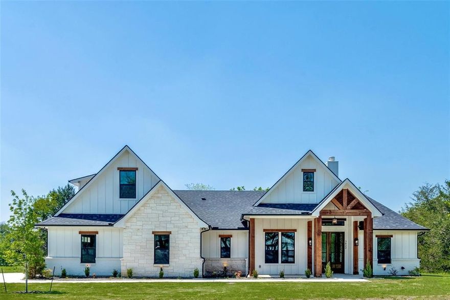 Large New Construction Home on a little over 1 ACRE. This 4 bed 3 bath home features a traditional and modern design, with beautiful wood features an open floorplan, an elegant kitchen, a large living space, 2 dining spaces, a bonus room, and a covered back patio with gas hookups for a future outdoor kitchen. The kitchen features lots of cabinet space, beautiful countertops, a butlers pantry, wine fridge with a dry bar, and stainless steel appliances. The living room features a large fireplace, lots of natural light, vaulted ceilings and recessed lighting. The master bedroom is next to the walk in laundry room. The master bath has a large shower, a garden tub, and a double vanity. Off of the master bath you will find a HUGE walk in closet. Upstairs you will find a bonus room or 4th bedroom with a full bath and closet. This home has many more luxury features that is a must see in a very desired and upcoming community.