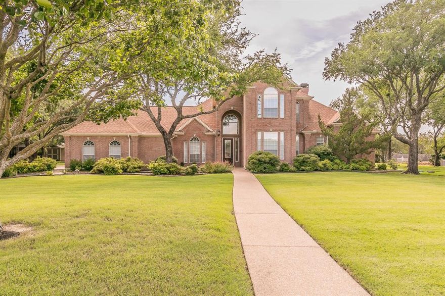 ALEDO ISD!!  Discover this stunning home located in the highly sought-after Oak View Estates community! Nestled on 0.8 acres, this beautifully landscaped and spacious residence features three large bedrooms, two and a half baths, and three expansive living areas, including a cozy fireplace. You'll also find a private study that could be a fourth bedroom or nursery and an oversized three-car garage. Shop on the property, but there is plenty of space to add another shop or build a large custom shop.

The luxurious primary suite serves as a true retreat. Its spa-like bathroom includes a separate walk-in shower, a tub, and a generous walk-in closet. The gourmet kitchen boasts granite countertops, custom cabinetry, and an open layout. It is perfectly positioned between the breakfast nook and the formal dining room.

Upstairs, there is a generously sized living area, two guest bedrooms, and a Jack and Jill bath. The upstairs balcony offers breathtaking views and endless possibilities, whether you envision it as a guest suite, game room, or additional living space.

Step outside to your private backyard oasis, which features a remodeled pool, an outdoor covered patio, and ample space for entertaining or relaxing in total tranquility. Additional features include a Class 4 hail-resistant roof, six-inch crown molding, floor-to-ceiling windows, and solar screens.

This exceptional home is a rare find, so schedule your showing today! The HOA is voluntary. Conveniently located with easy access to I-20, you'll be just minutes away from shopping, dining, and the entertainment options of Weatherford, Hudson Oaks, Willow Park, with a short drive to downtown Fort Worth and DFW Airport.