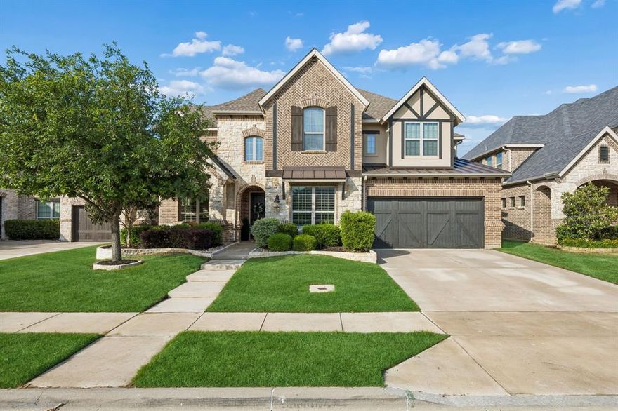 Located in the amenity-rich Canyon Falls community, and walking distance to both Argyle High & Argyle South Elementary, this exceptional home impresses from the moment you arrive—beginning with its inviting, front walkway framed by stone-edged landscaping and extending to the NE facing backyard retreat featuring a sparkling pool & spa. Whether hosting vibrant summer gatherings or weekend game day celebrations under the covered patio with fireplace, this backyard was thoughtfully designed for making lasting outdoor memories. Inside boasts wood flooring, plantation shutters and an open layout with vaulted ceilings & sparkling pool views. Kitchen is thoughtfully appointed with granite countertops, extended shaker cabinetry with decorative lighted uppers, double ovens, gas cooktop, and built-in desk area adjacent to the walk-in pantry featuring an Elfa organizing system.  Primary suite, with shimmering pool views, features bowed windows, a tray ceiling and spa-inspired ensuite with dual vanities, soaking tub, and separate walk-in shower. First floor also features a dedicated office with french doors and downstairs guest suite offering flexibility for guests or multi-generational living. Upstairs, the home continues to impress with custom built-in shelving, 3 additional upstairs bedrooms and a spacious game room along with a dedicated pre-wired media room - that transforms movie nights into a true cinematic experience. SPECIAL HIGHLIGHT: EXTENDED OVERSIZED EPOXIED GARAGE! Incredible location - located less than 1 minute to the new Flower Mound Canyon Falls Park, featuring hiking and walking trails, a sports court, splash pad, and playground. Residents also enjoy full access to Canyon Falls’ exceptional amenities, including a fitness center, two resort-style pools with an additional splash pad, multiple playgrounds, scenic fishing spots, a dog park, miles of trails, and community events. Front yard maintenance, internet, and cable are included in the HOA.