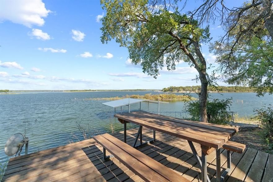 Motivated seller- Now offered at $499,000 with $20,000 toward buyer closing costs or interest rate buy-down helping reduce your monthly payment (with acceptable offer). 
Imagine waking up to lake views, spending your mornings on the dock, and ending the day watching the sun set over beautiful Lake Leon. With water views from almost every room, this move-in-ready lake home was designed to be lived in and enjoyed.The two-story layout offers a spacious primary suite and guest suite on the main level, with four additional bedrooms, a full bath, and an extra tucked away flex space or game room upstairs. The home feels comfortable, open, and ideal for gathering with family and friends.Step outside to your private dock and elevated viewing deck, whether it’s morning coffee, afternoons on the water, or quiet evenings taking in the view, this is lake life at its best. The property also has a proven short-term rental history, including a month generating over $10,000.