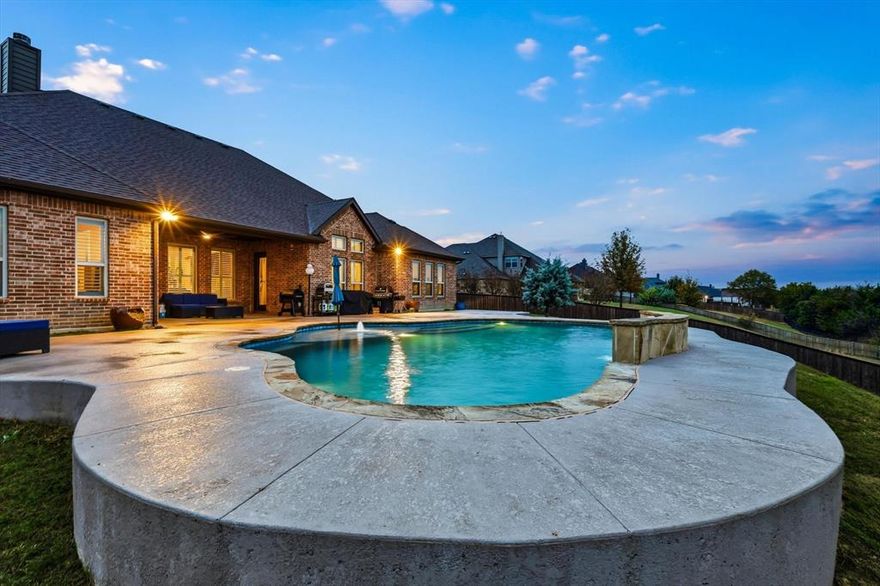 This one is a stunner! Immaculately maintained John Houston custom home loaded with upgrades and set on a peaceful, park-like lot with unforgettable sunset views. Waxahachie ISD and NO CITY TAXES! From the moment you walk in, you’ll feel the pride in ownership and thoughtful design throughout. Inside, enjoy granite counters, hardwood floors, stainless appliances, upgraded doors, and beautiful plantation shutters. The soaring peaked ceilings with wood beams create a warm, elegant feel in the main living and dining areas. This flexible floorplan offers 4 bedrooms, 3 full baths, and a bonus room with its own private access to the back patio, which is perfect for a playroom, TV room, or home gym. The front room with French doors includes a closet and can serve as an office or a true 5th bedroom.

Step outside to your own retreat: a lush, treed backyard overlooking wide-open views and a sparkling A Oasis designed pool, ideal for relaxing or entertaining. All of this sits in the highly coveted Summit Estates neighborhood in Waxahachie. The yard continues beyond the back iron fence into the woods where you can explore the creek or nestle around a fire pit.  

A beautiful and well loved home inside and out, ready to bring your style and make it your own.