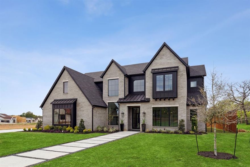 Luxury new construction by Beckett Graham Homes. With a blend of traditional and contemporary elements, the open floor plan combines the main living areas allowing for a seamless flow and an ideal space for both formal entertaining and casual family living. Offering abundant natural light, clean lines and true open concept living. The home features a home office, dining area, three living spaces and a dedicated wine room. Upgrades include grand entry with 20' ceiling, floating staircase, sliding glass doors allowing indoor-outdoor living, an outdoor kitchen and a spacious backyard with room for a pool. This home boasts four bedrooms and four and a half bathrooms, including a main floor primary suite with a luxurious bathroom and three additional bedrooms all with en-suites.  This home offers excellent private and public school options, effortless commute to DFW Airport, access to high-end shopping, fine dining, top-tier fitness centers and direct access to miles of trails.