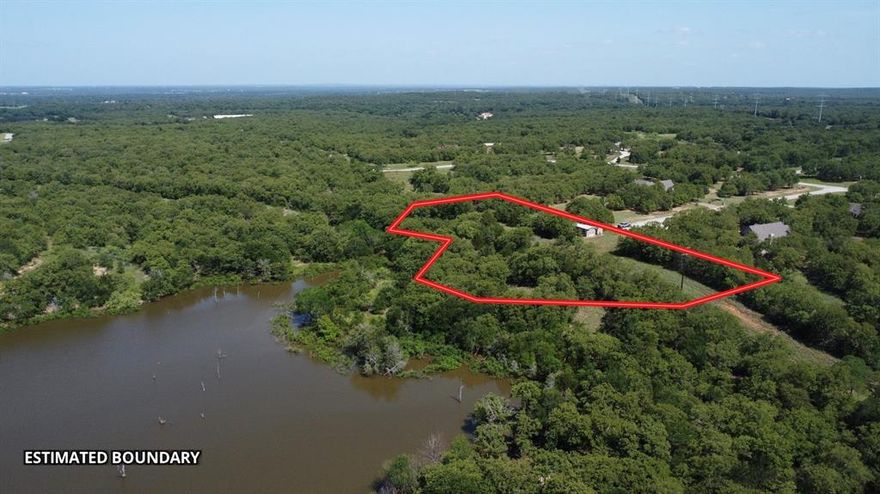 GENERAL DESCRIPTION: This 2.75 acre tract sits on the south side of Lake Amon Carter, offering great views of the lake and surrounding nature. The property acts as almost a 5 acre tract with unincorporated land surrounding it on all but the south side. Alongside the unincorporated land there is over 600 FT. of lake frontage to Lake Amon Carter, only accessible through this property. This 2.75 acres is being cut from a larger tract, offering the buyer the potential to add more acreage. 


LOCATION: Property is just north of the silver lake community. 
~30 Miles to Decatur, TX
~70 Miles to Fort Worth, TX 
~80 Miles to Dallas, TX


WATER: Lake Amon Carter sits directly to the north of the property, which was ranked one of the top-10 places to fish for large-mouth bass according to the Texas Parks and Wildlife Department website. The lake covers more than 1,800 acres and is 50 feet deep at its maximum depth. There is no water skiing on the reservoir side of the lake.


CLIMATE: Sunset, TX, averages 242 sunny days, one inch of snow per year and 33 inches of rain per year. 


UTILITIES: Property is connected to water through City of Bowie Water and has a septic system installed.  
The electric provider is Wise County electric. There are electric poles on the road frontage of the property, but a meter would need to be installed. 


WILDLIFE: White-Tail Deer, Duck, Hogs, Varmints


TERRAIN: The property has a slope from the road frontage towards the lake frontage, with contour starting at 950 FT sloping down to 920 FT. 


IMPROVEMENTS: There is an older manufactured home on the property, which will need TLC before being a full time residency. The home is a 2 bed 2 bath with a front porch alongside the north side of the home. The porch opens up to different decks which offer great views of the lake and surrounding native hardwoods. The is a storage shed just south of the house that currently holds kayaks that the sellers take out on Lake Amon Carter.
