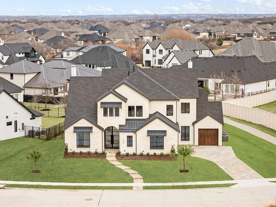 Stunning custom home in Prosper! This home has the perfect plan for entertaining. Wide open great room that opens to large, covered patio - allowing for indoor-outdoor parties. Chefs' kitchen has all the latest in appliances and also features a large walk-in pantry. Private owners' retreat that overlooks the back yard, boast a spa like bath with huge walk-in shower and elegant free-standing tub. Study on the front of the home features tall ceilings, French doors, and window that overlook the covered front porch. Two additional bedrooms are located on the first floor. Upstairs features a large game room and media with balcony, adding to your entertaining possibilities. Three additional bedrooms, each with access to bath and walk-in closet, complete the second floor.