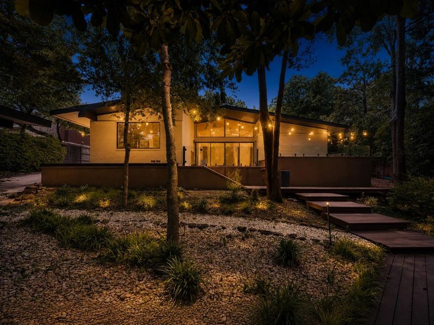 Extensively Renovated North Dallas Mid-Century Retreat with Heated Pool, Generator & Rare 0.36-Acre Lot.

Coveted Hillcrest Homes neighborhood, this extensively renovated 3-bedroom, 3-bath mid-century modern home on a rare 0.36-acre lot with mature trees, a heated pool, and two outdoor living areas designed for easy Dallas living. This is not a flip or a surface-level refresh. It is an owner-upgraded home where major systems and everyday essentials have already been addressed, while preserving the character that makes a mid-century home special. The bright, open main living area features large windows, built-ins, clean mid-century design, and an easy connection to the backyard.

Strong curb appeal, with mature magnolias and tree canopy, maples that create a private, shaded setting. The backyard features low-maintenance landscaping, full sprinkler coverage, generous green space, a heated pool, and separate areas for dining, lounging, and entertaining. 
Smart Home, Systems & Appliances
Major upgrades include updated plumbing and electrical, 2025 AC, a WiFi-connected whole-home generator on city gas, updated refrigerator, dishwasher, washing machine, and utility-room flexibility with outlets for a second washer dryer setup. Smart-home features include smart light switches, app-based sprinkler control, smart locks with cameras, high-speed connectivity, a projector-based home theater, integrated Tonal fitness system, and smart toilets with integrated bidets.

Safety, Separation & Pet-Friendly Details
Thoughtful features to make daily life easier for families, guests, work-from-home needs, and pets. These include a large dog door, cat door between the office and living room, modern glass porch fencing, retractable pool fencing, added backyard fence netting, glass doors between rooms for flexible separation, and retractable kitchen gates.