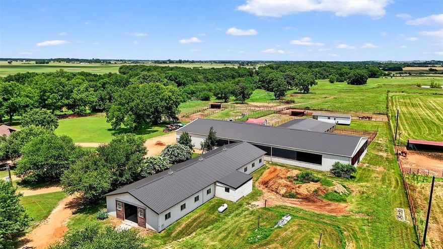 HERE IT IS! Turnkey horse property on approx. 27 acres located in Collinsville, TX, in the heart of Horse Country USA. This professionally maintained equestrian estate offers multiple homes, extensive horse facilities, and a private, functional layout ideal for any horse operation. The main home is 3,967 square feet and was fully remodeled six years ago, with additional updates in 2024 including new windows and roof. The residence includes 3 bedrooms, 3 full bathrooms, a half bath, an updated kitchen, spacious living areas, and a large backyard with pool, patio, and separate pool house with a full bath and living area. Horse facilities include a 70x120 covered riding arena, LARGE outdoor arena, and two barns offering a total of 24 stalls. The show barn features 14 stalls, 2 tack rooms, and an office. The mare barn offers 11 stalls with 5 turnouts. The property also includes a 38x60 shop, 12x38 hay storage, multiple paddocks, fenced and cross-fenced pastures, and ample trailer parking. Three ponds, gated entrances, and well-planned infrastructure make this a fully operational property. Additional living spaces include an updated apartment attached to the barn, and an optional tiny home that can be for purchase for expanded living or guest accommodations. This rare offering provides a complete setup for horses, ranch operations, and multi-generational or staff housing. Located in a peaceful and highly sought-after area with easy access to major equine facilities, this property is ready for immediate use and future expansion. Seller would split up and divide. See MLS # 21155487 for this property with 55.34 ac and another additional house. EXCLUDES Pool table light in Game room, Shelves in Living Room, portable pool vacuum, dog kennel by chicken house, Tiny house - will price tiny house