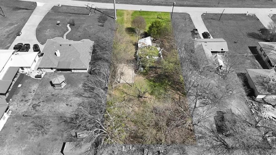 Bring your plans and build your dream home on this spacious, buildable interior lot. Located in the vibrant heart of Wilmer, this generous 0.228-acre parcel showcases mature crepe myrtle trees, a stately evergreen cedar, and a private driveway, providing an ideal foundation for creating the perfect home of your dreams.