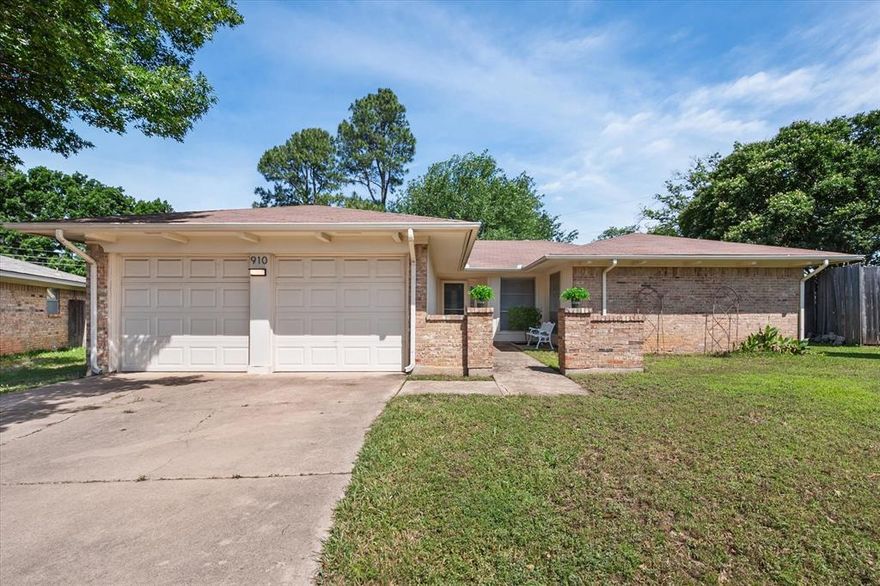 Charming, single story home in N Arlington offers blend of comfort, character and opportunity! From moment you arrive, inviting front courtyard creates warm first impression and offers extra outdoor space for morning coffee, quiet evenings or welcoming guests. Inside, discover spacious and light-filled layout designed for both everyday living and entertaining. Expansive living area immediately captures attention w vaulted ceilings, exposed wood beams and striking floor-to-ceiling brick fireplace. Large windows allow natural light to pour in, creating airy and welcoming atmosphere throughout. Open flow between the living room, kitchen and dining area makes home feel connected and functional while offering cozy spaces to relax and unwind. Kitchen is filled with timeless charm; featuring generous cabinet and counter space, center island and a layout that makes cooking and gathering effortless. Adjoining dining area overlooks backyard and provides perfect setting for casual meals, conversation and everyday moments. Spacious primary retreat offers peaceful escape w room for sitting area, reading nook or personal workspace; while additional flexible bedroom spaces easily adapt to lifestyle needs - guest rooms, home office, hobby room or fitness space; you have freedom to make your own. Outside, large backyard is ready for entertaining, gardening or simply enjoying outdoors. Covered patio creates ideal extension of living space and invites hosting weekend barbecues, unwinding after long day or enjoying quiet evenings.  Located in established neighborhood known for  mature trees, convenient access and central location; home places you close to shopping, dining, parks, entertainment and major commuting routes while still offering the peaceful feel of tucked-away community. With its inviting spaces, timeless character and endless potential to personalize; this N Arlington home is ready for next chapter and for someone to truly make it their own.