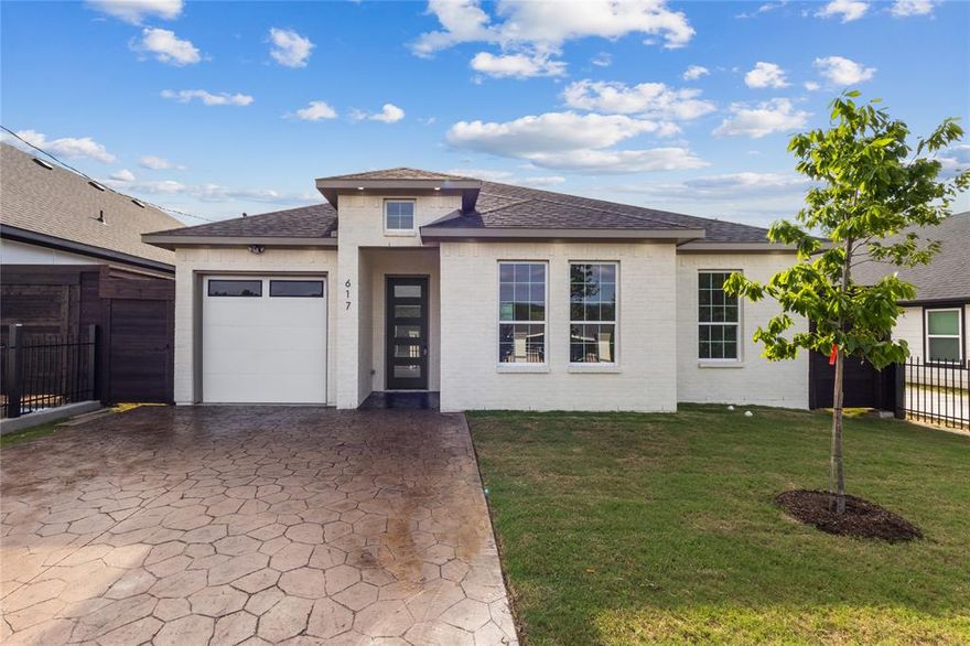 Brand new construction just 10 minutes from Downtown Dallas! This stunning 4-bedroom, 2-bath home features a modern open-concept layout designed for both everyday living and entertaining. The spacious living, dining, and kitchen areas flow seamlessly together with abundant natural light throughout. Enjoy a fully fenced yard offering privacy and space, plus a large backyard perfect for gatherings, pets, or future outdoor additions. The tall oversized covered back patio creates the ideal outdoor living space for relaxing or entertaining year-round. The home also features a custom textured concrete driveway that adds unique curb appeal and style. Don’t miss this opportunity to own a beautifully built new home in a convenient Dallas location close to downtown, dining, shopping, and major highways.