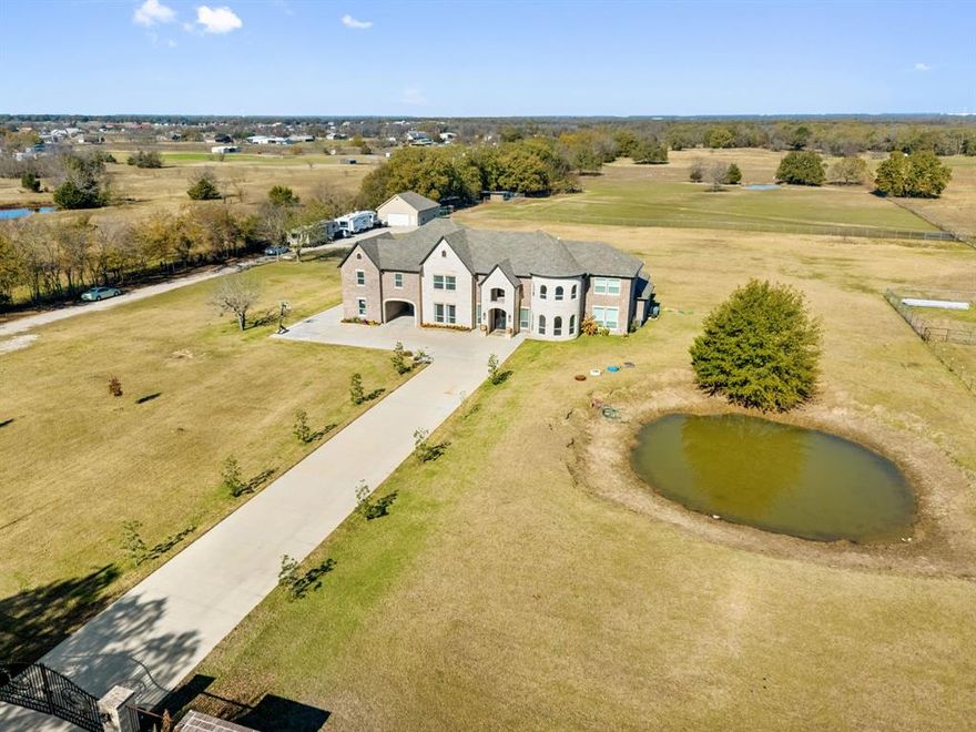Exceptional Gated Multigenerational Estate on 10.1 Acres in Royse City, Texas, total of 7,998sq ft of living space and offering privacy, and flexibility. The private gated entrance welcomes you into this expansive property designed for comfortable everyday living. The main residence spans an impressive 6,645 sq ft, featuring 6 bedrooms, 5 full bathrooms, and 2 half bathrooms, office, media room, dining room, 2 living rooms, 1 game room, open gym room and laundry room thoughtfully laid out to accommodate large or extended families. Interior highlights include quartz countertops, hand-scraped hardwood flooring throughout the home, custom built-in cabinetry in closet areas, 9ft ceilings in second floor, 10ft ceilings downstairs. In addition to the main home, the property includes two separate multigenerational residences, ideal for extended family, guests, or private living quarters. One residence offers 706 sq ft, while the second provides 645 sq ft, providing exceptional versatility for multi-household living, home offices, or guest accommodations. Each unit has their own kitchen, living room, full bathroom, bedroom with walk in closets. Exterior features two Ponds, Metal shop, RV hookups and fully fenced in for all your horses and cattles. Set behind a private gate and surrounded by open acreage and wide-open TEXAS skies, delivers peaceful country living with endless possibilities—yet remains just minutes from shopping, restaurants, and Lake Ray Hubbard, with quick access to major highways and located within the Royse City ISD. Come see for your self everything is bigger in Texas!
