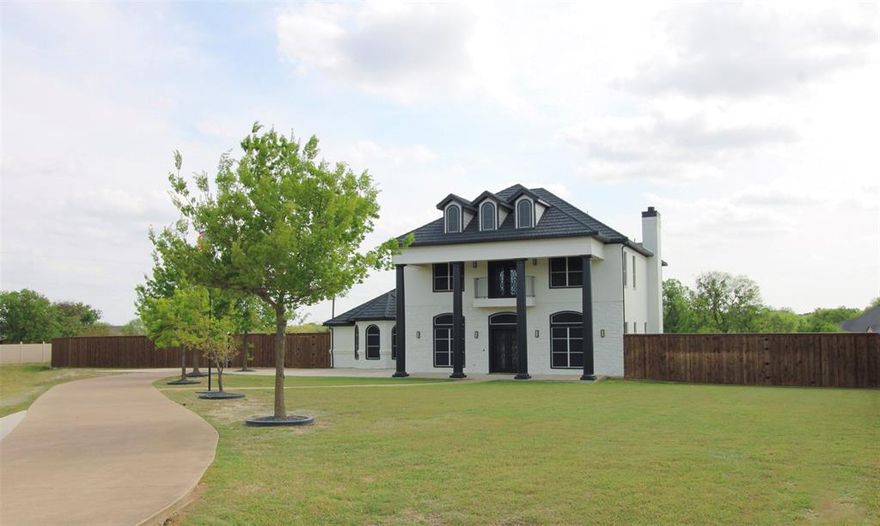 Welcome to this exquisite 4-bedroom, 3-bath home, offering 3,475 sqft of luxurious living space on a sprawling 1.26-acre lot. Built in 2009, this fully insulated residence boasts a modern, updated kitchen and refreshed bathrooms. The open floor plan flows effortlessly, with a fully fenced yard, ample parking areas, and updated AC units for year-round comfort. Enjoy outdoor evenings under the glow of jellyfish exterior lights, and relax in the theater room with its vibrant jellyfish lighting. A backup generator ensures peace of mind, and the home’s charm is matched only by its convenient location. Don’t miss this perfect blend of space, style, and functionality—schedule your private tour today! Seller providing $825 1yr home warranty with free rekey service.