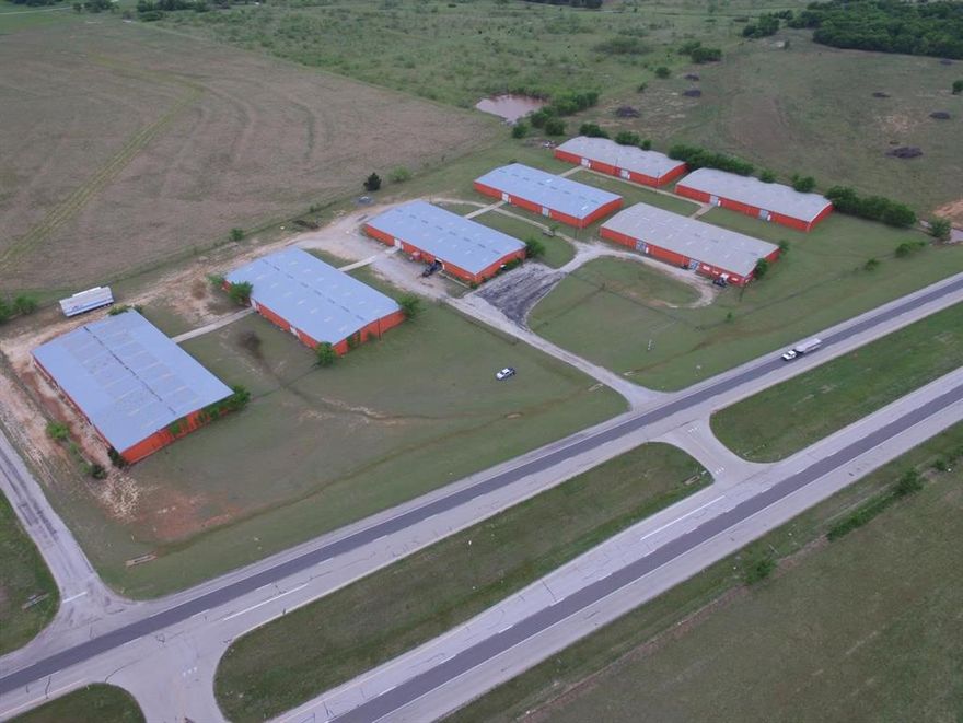 Approx. 11.92 ACRES or 519,205 sf of Land Approx. 140,000 SF of Warehouse Space broken up into 7 20,000 SF Buildings Texas Country location on busy U.S. Highway 82, 2 Miles East of Nocona, TX. In Montague County. Traffic count high is 3,867 vehicles a day.  Located in ETJ