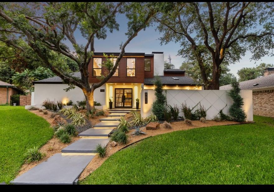 Welcome to a distinctive oasis in the heart of Dallas’s coveted Town Creek neighborhood. Tucked away on a quiet street and just minutes from White Rock Lake, Royal Oaks Country Club, and Medical City, this stunning home offers a rare blend of luxury, design, and location. RISD School District!

Step inside to soaring vaulted ceilings and an expansive open floor plan, ideal for both daily living and entertaining. The chef’s kitchen is a showstopper, featuring Taj Mahal quartzite countertops, custom rift-sawn white oak cabinetry, a 9-foot island, Wolf and Thermador appliances, and a 105-bottle wine fridge. A sleek dual-sided fireplace elegantly divides the dining and living areas.

The spacious primary suite is conveniently located on the main floor, offering access to a private patio retreat through dramatic folding doors. A flexible adjoining room provides options for an office, nursery, or expanded closet. Upstairs you'll find French white oak engineered floors, three additional bedrooms, a full bath, and a versatile loft living area.

Additional highlights include a gated front entry courtyard, fenced backyard with covered patio, and premium finishes throughout. 9611 Fallbrook is a true modern sanctuary—schedule your tour today!