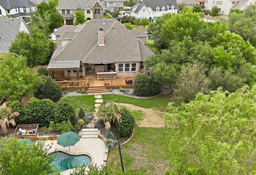 Welcome home to 502 Prairie Run, one of the most exceptional homes in Parks of Aledo! On one of the largest lots in the neighborhood, this stunning home backs up to trees on two sides for incredible privacy. Inside you’ll find high-end living in a great floorpan. This 5-bed, 4-bed flexible floor plan home offers a 3-car garage and upgrades around every corner: designer lighting, custom wallpaper, a California Closet, and a layout that just lives beautifully. The backyard is a real show stopper. From the custom deck and designer landscaping to the perfectly positioned pool, it truly feels like a private resort. Single, third-car garage has its own AC unit perfect for an additional living space or workshop, but with a flip of a switch, it can operate as a traditional garage space. This is one you don’t see come around often!