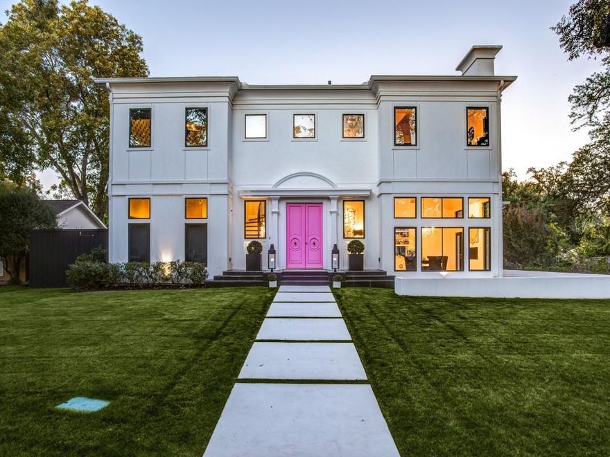 Modern-Transitional built in 2014 with just under 5000sqft. 4 bdrms, 4.1 bathrooms. Upon entry, one is immediately struck by the boldness of the color palette: black, white, warm metallics, & pops of pink. A dramatic black vintage Murano glass chandelier hovers over the living space. As guests descend the stairs into the LR. The light emanating from the many windows & two sets of French doors softens the mood. The kitchen, grounded by a black floor, is otherwise entirely white. With only acrylic & gold metallic accents, it feels light as air. The white & grey marble countertops & backsplash tie in w-the custom white cabinets perfectly. The large waterfall island offers the perfect gathering space for this fun loving family. The brass chandelier over the breakfast table provides a breathtaking finishing touch. The elegant backyard, complete w-a glistening rectilinear pool, can be seen from almost every back window of the home. This home is indeed an iconic showcase of taste & style.