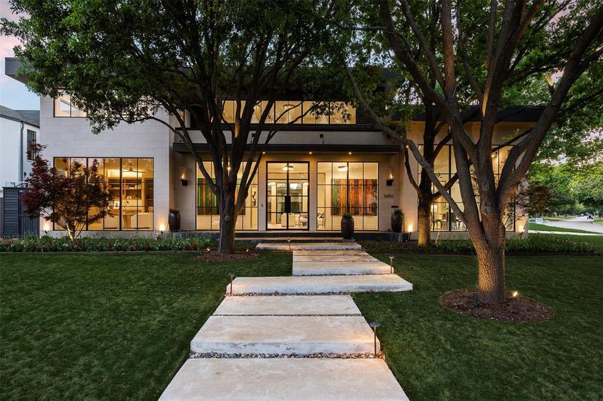 Situated within one of Dallas' most desirable areas, this Preston Hollow home has been meticulously crafted with no detail left unturned. The open and bright floor plan features floor-to-ceiling glass windows that allow for effortless entertaining no matter the season. The first floor includes a spacious living area, an office, a formal dining room, and a large gourmet kitchen that opens to a breakfast area. The downstairs master suite boasts a vaulted ceiling, a marble master bath, and his and her closets. The second floor includes four bedrooms (two ensuite and two with jack and jill baths), a huge game room, and a flex room that can be used as a gym. The outdoor oasis features multiple covered seating areas, an outdoor full kitchen with a built-in grill and green egg, two fireplaces, built-in heating lamps, cooling fans, and a waterfall that emits from the patio.