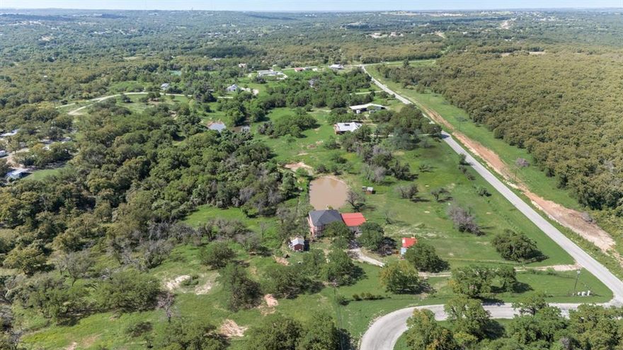 Welcome to 2277 County Road 3657 — a rare opportunity to own 10 acres in the peaceful countryside of Springtown, TX. Designed with rural living in mind, this versatile property features dedicated livestock areas and a massive 100x100 ft barn, ideal for horses, cattle, or equipment storage.

The main home was built in 2020 and includes a recent renovation in the back, blending comfort with modern updates. A private water well, septic system (installed 4 years ago), and available electricity and internet ensure you’re fully equipped for both everyday living and agricultural use.

Enjoy natural Texas beauty with mature shrubs, a tranquil pond, and wide-open views. With plenty of space to roam, farm, or raise animals, this property offers the perfect balance of functionality and serenity.

Whether you're seeking a hobby farm, homestead, or weekend escape, this is country living done right.