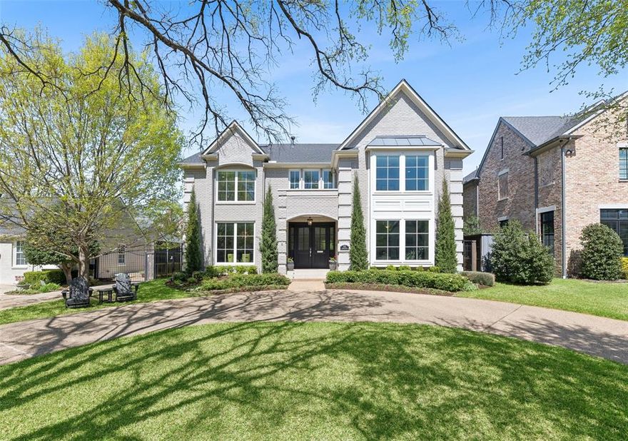 3132 Stanford Avenue – Updated University Park home in HPISD zoned to Boone Elementary, on a 60x140 lot, featuring a fully remodeled kitchen, 5 bedrooms, 5 baths, pool and spa, whole house generator, and 5,104 square feet of refined living. This beautifully updated home blends timeless architecture with elevated interiors, offering exceptional space and functionality in one of Dallas’ most desirable locations. A circular drive and manicured landscaping create a striking first impression, leading into interiors defined by hardwood floors, elegant millwork, and multiple inviting living areas. The main living room features a fireplace, custom built-ins, and expansive windows overlooking the backyard, filling the space with natural light. The fully remodeled kitchen is both stylish and highly functional, showcasing a built-in refrigerator, extended custom cabinetry for abundant storage, and seamless flow into the breakfast and living areas—ideal for everyday living and entertaining. A formal dining room and additional living spaces provide flexibility for a variety of lifestyles. The primary suite is enhanced with a private coffee bar and wine refrigerator, along with a luxurious bath featuring elevated finishes and a towel warmer for added comfort. Direct access to a private balcony completes the space. The third floor adds exceptional versatility with a media room, bonus living spaces, and ample storage, easily adaptable to a game room, fitness area, or additional workspace. Outdoor living is equally impressive, with a covered patio and a beautifully designed pool and spa with water feature, all set within a private backyard—perfect for relaxing or entertaining. A whole house generator and extensive updates further elevate the home, delivering comfort, style, and everyday livability in a premier University Park setting.