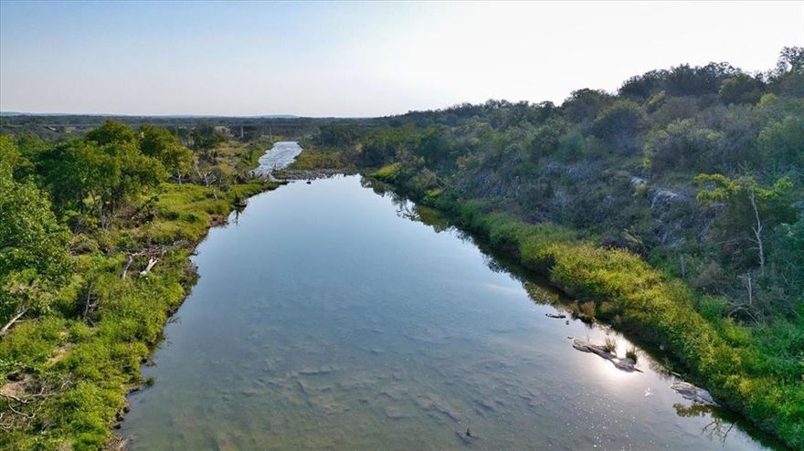 The High View River Ranch is your opportunity to own a remarkable live water piece of Texas real estate! This 115 acre ranch boasts 3800+ feet of San Saba river frontage and offers multiple hilltop views of the beautiful Heart of Texas area. It is located in Voca,TX on Highway 71 between Llano and Brady making it a perfect gateway to all that central Texas has to offer. The terrain features rolling elevations that vary from a low of 1500 feet along the water, to highs of 1590 feet, creating scenic meadows and huge views throughout. Ancient Live Oaks, Shin Oak, native Pecan and Mesquite trees create private park-like settings along the riverbanks. The ranch is rectangular in shape and fenced on 4 sides with two entrances from Highway 71. Agricultural exemption for property taxes, electricity and a water well are already in place. Access to portions of the river have recently been cleared, as well as a roadway across the length of the ranch for ATV and vehicle travel. Wear your boots and be ready to explore the various features this unique property has to offer. Hunting, fishing, swimming and searching for arrowheads are a few things that come to mind. Recreational use, residential or event venue- make this peaceful 115 acre ranch the idyllic river ranch you've always wanted. The owner has taken careful consideration to reveal the possibilities this ranch has to offer, the rest is up to you! Located in Voca, TX (McCulloch County) : 13 miles from Brady, 59 miles from Brownwood, 67 miles from Fredericksburg and 115 miles from Austin.
