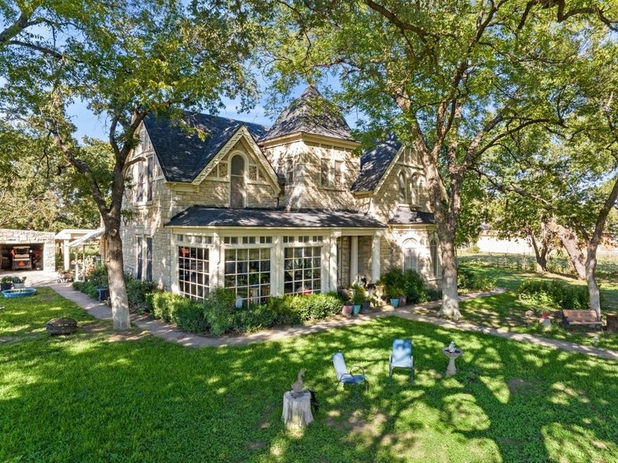 Historic Lindsey-Gore Home, built in 1883. Walls are 18in. thick limestone. Ceilings downstairs are approx. 12 ft high. First floor windows have custom fitted plexiglass inserts for energy efficiency. 3 fireplaces: living, and 1st floor bedrooms. Primary bath, 1st floor has clawfoot tub, and shower. Main bath has a shower and Utility Rm. Large formal dining room, granite countertops in kitchen, electric oven with antique charm, and breakfast area. Mud room w workshop, sink. Upstairs, New carpet, full bath with Clawfoot tub and 3 spacious bedrooms. This 7.7 AC Lot with pond is cross fenced to keep the horses in their area. The well services the horse troughs and inground sprinkler system. Electric gate for security. Outside buildings; stone barn, 2 car garage, shed, RV Carport, carport, and chicken coop. Two Carrier: 4 ton heatpumps, 1 Rheem AC, 1 unit 1 yr old, 1 is 5 years old. Property has several mature pecan and oak trees, an apple and fig tree.
