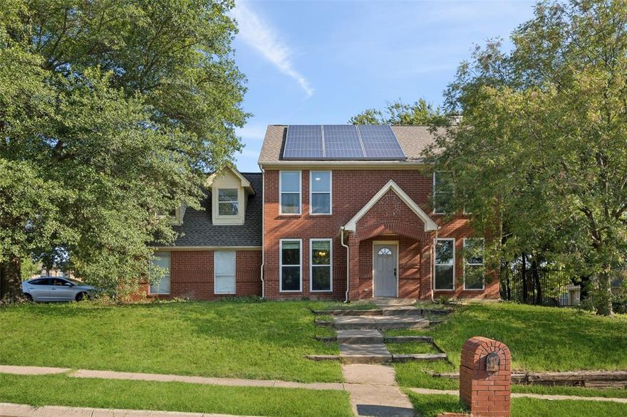Welcome to this recently updated two-story home, ideally positioned on a large corner lot in a well-kept Euless neighborhood. Built in 1991 with 1,990 square feet, it blends timeless character with modern upgrades. Mature trees, an elevated side yard, and landscaped surroundings create inviting curb appeal, while solar panels provide energy efficiency with a leased plan where you only pay for usage and are protected from rate increases. Inside are four bedrooms and two-and-a-half baths designed for comfort and versatility. The primary suite features dual closets and a bath with a garden tub and separate shower. An oversized secondary bedroom offers flexibility as a game room, media space, or office, while two additional bedrooms provide ample room for guests or household needs. Natural light flows through new south-facing windows (2021), brightening the interiors. The kitchen, fully remodeled in 2022, showcases sleek cabinetry, updated appliances, and modern countertops. Additional upgrades include a new roof (2021), water heater (2021), garage door opener (2025), siding replacement (2025), and a Trane heating and cooling system (2021), ensuring durability and efficiency.Fresh paint and updated fixtures enhance the move-in-ready appeal. Outdoors, the corner lot provides generous space for gardening, play, or evenings beneath the trees. The elevated side yard adds dimension, while thoughtful landscaping enhances privacy. 7 min (3 miles) from the TRE train stop, which connects both major cities. Easy access to highways 121, 183, 360, 161, and 820 makes commuting convenient. Located within the highly respected Hurst-Euless-Bedford school district (new neighborhood elementary school is under construction), the home is also near parks, playgrounds, green spaces, walking paths, and sports fields. This home offers space, comfort, and convenience in one of Euless’s most established neighborhoods, with modern improvements and classic appeal ready to welcome its next owner.