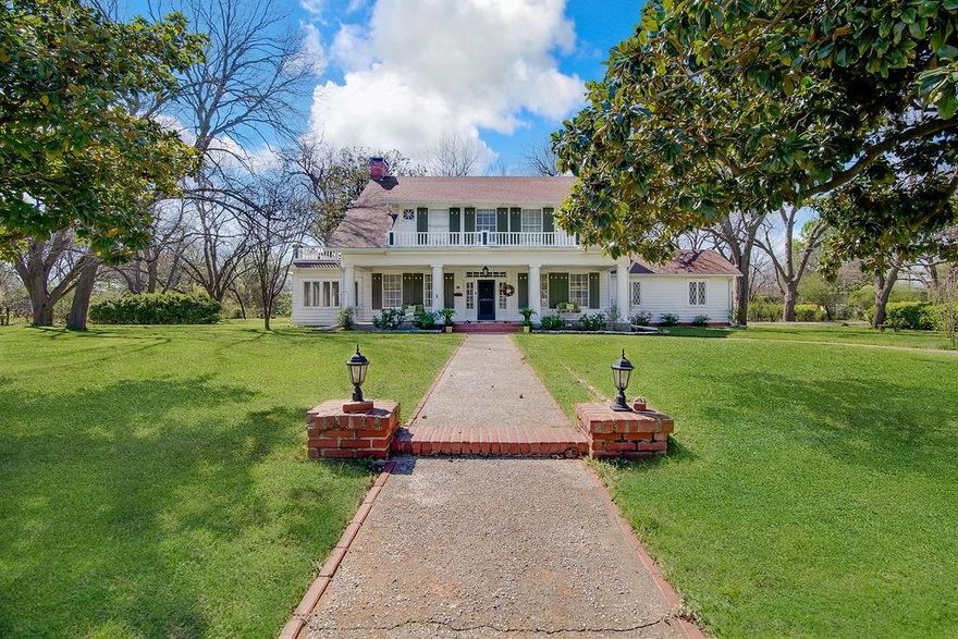 Welcome to this stunning 1930 corner-lot home, where timeless character meets thoughtful updates. Offering 3 bedrooms, 3 full bathrooms, and a detached 2-car garage with an attached workshop with electricity, this property delivers both charm and functionality.

Step inside to a grand staircase that immediately sets the tone. To the left, the formal living room features a wood-burning fireplace and French doors that open to a light-filled enclosed sunroom that's complete with operable windows for fresh air. Just beyond, a versatile flex space currently serves as a breakfast area but easily functions as a home office or study.

To the right of the entry, the formal dining room showcases beautiful built-in cabinetry and shelving, along with a second wood-burning fireplace. The dining space flows seamlessly into the fully renovated kitchen, featuring custom cabinetry, updated appliances, a walk-in pantry with saloon doors, and generous counter space.

Just off the dining area, the main living space is filled with natural light and offers built-ins plus an attached full bath,  giving it the potential to be utilized as a second primary suite, guest quarters, or media room.

Upstairs, the primary suite includes ample closet space and a private ensuite bath. Two additional bedrooms are thoughtfully separated, each with great closet storage. One bedroom features its own updated ensuite with a vanity area and a large soaking tub.

Outside, enjoy a pergola-covered outdoor living space, perfect for relaxing or entertaining, along with the detached garage and workshop.

This is the kind of home you don’t come across often; full of original character, but updated where it counts.
