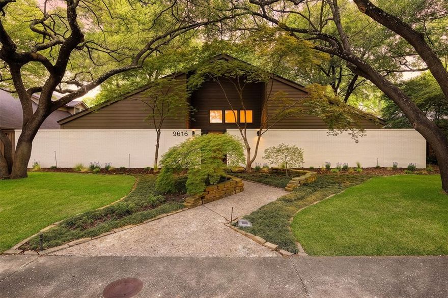 Tucked beneath a canopy of mature trees in the heart of Lake Highlands, this exquisite late-century modern residence, reimagined by Maverick Design, is the one you’ve been waiting for. A striking front elevation with a private courtyard-style entrance creates unforgettable curb appeal from the moment you arrive. This four bedroom, three bath home offers soaring vaulted ceilings, expansive walls of windows and doors that frame the lush landscaping, and wide-plank wood floors fill the home with warmth, character, and natural light. The dramatic main living area is anchored by a floor-to-ceiling brick fireplace and flows seamlessly into the dining area and designer kitchen, creating an effortless setting for both entertaining and everyday living. Thoughtfully designed with both style and function in mind, the kitchen features quartz countertops, an island, professional-grade gas range, statement lighting, and a bright breakfast nook overlooking the pool. This modernist residence has multiple indoor and outdoor living and dining spaces offer incredible flexibility for hosting guests, working from home, or simply relaxing. Privately situated on its own side of the home, the primary offers vaulted ceilings, a cozy fireplace, spa-inspired bath, soaking tub, walk-in shower, spacious walk-in closet, and direct access to the backyard. On the opposite side of the home, you’ll find three additional bedrooms, including two connected by a shared bath, while the third offers exceptional flexibility as a private office or guest retreat complete with its own patio access. Step outside to your resort-style backyard surrounded by towering trees and lush landscaping, complete with a sparkling pool and expansive patio spaces that are perfect a backdrop for entertaining. Ideally situated on a double cul-de-sac with no through traffic and just moments from schools, shopping, dining, and more, this is a rare opportunity to own an updated architectural gem. Easy access to i635. See it today