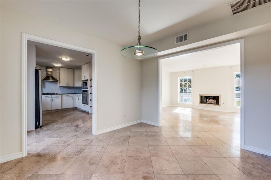 Corner lot townhome in prime location central to major highways, shopping, restaurants, and minutes from UTD. Home offers a private courtyard, 2 car garage and is situated adjacent to the community pool. Nicely updated townhome and low maintenance living with designer tile downstairs, natural hardwood floors upstairs. Primary bed offers an ensuite bath, with an oversized walk in shower with frameless glass. Cute kitchen offering updated granite, and a stainless steel GAS cooktop. Huge living room and a nice flex space that could be used for an office, formal dining, formal living, or even a nice game room. The roof was replaced in 2024.