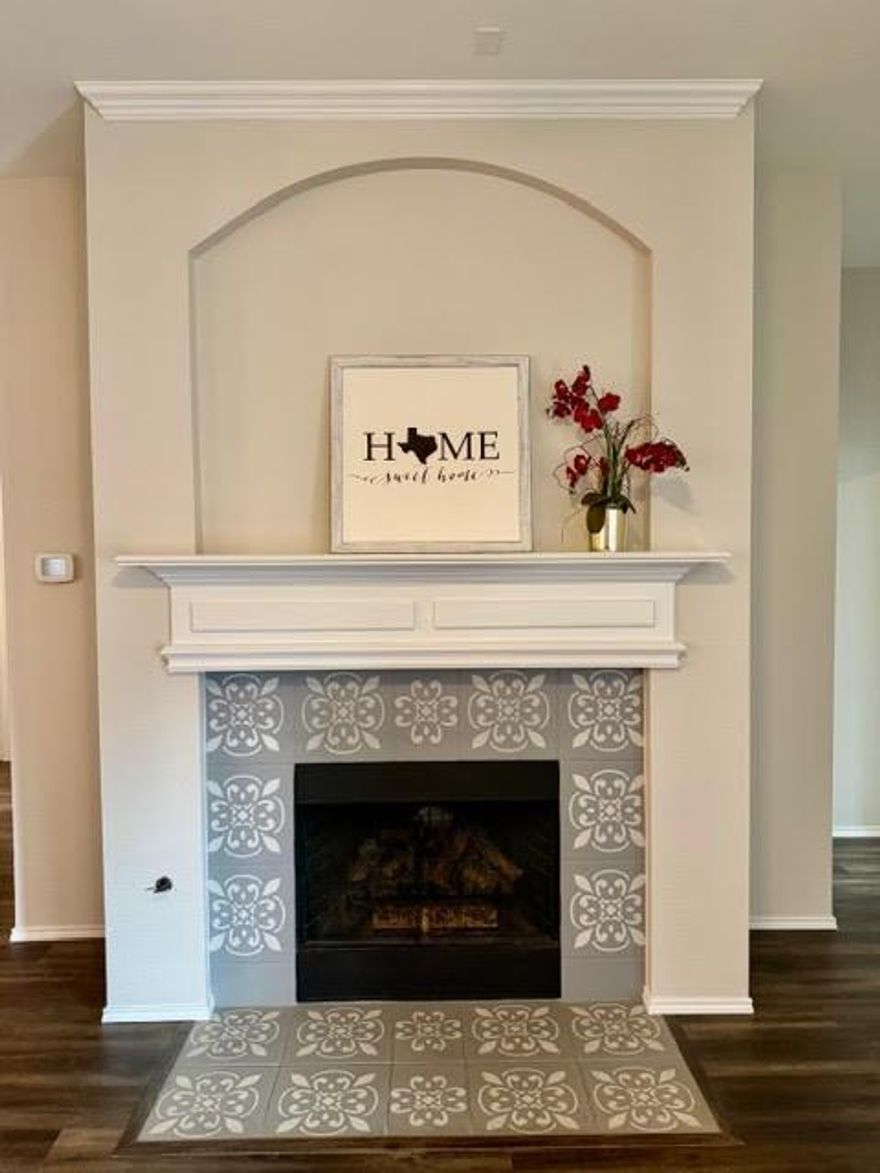 Charming and beautifully updated, this 3 bedroom, 2 bath, office, and bonus flex room with custom barn sliding door home offers approximately 1,962 square feet of thoughtfully designed living space. Fresh updates throughout include fresh new paint, new carpet in primary suite and closet, and stylishly updated light fixtures and ceiling fans, creating a warm and inviting atmosphere from the moment you step inside. Kitchen boasts granite countertops, gas range, designer lighting, wainscoted island, and flows generously to the living area showcasing a cozy gas fireplace with eye catching stenciled tile and white crisp mantle. The spacious primary suite offers a private retreat with bay windows, a sitting area, and serene ambiance. Step into your ensuite bath, relax and soak away the busy day in your garden tub or just take your shower to refresh. You will enjoy many hours relaxing on your back covered patio. Nestled in a charming neighborhood, this home combines style, comfort, and functionality.  As a unique bonus, this property may even be recognized from its appearance in an upcoming season of Lioness adding a special touch of distinction.  Don't miss this rare opportunity to own a home in the perfect location conveniently located to major highways, dining, shopping, top notch Northwest ISD, DFW airport and the quaint historical town of Roanoke, Texas.