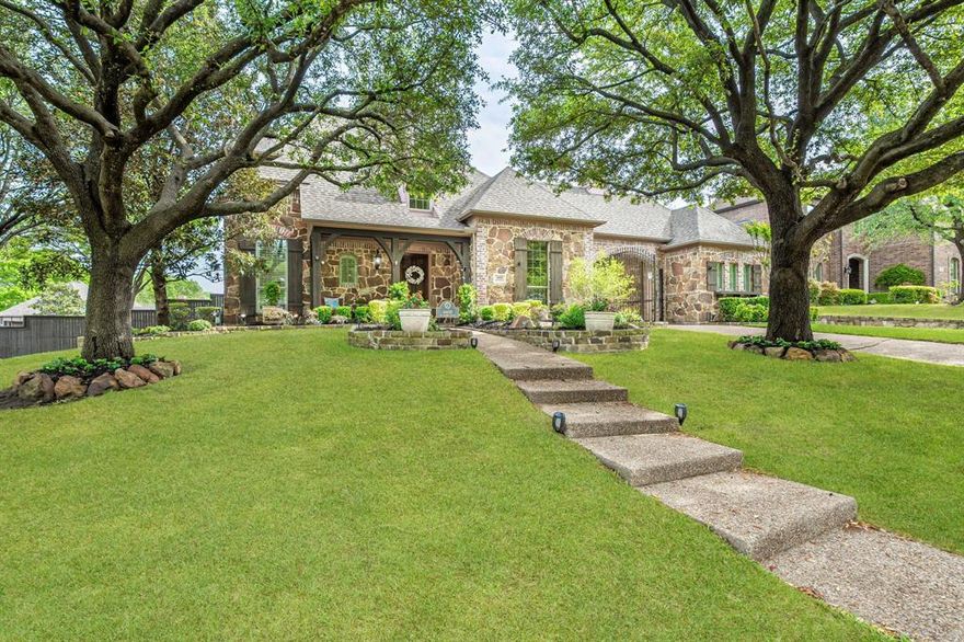 Exquisite luxury living awaits in this exceptional McKinney estate, gracefully positioned on a large corner lot with a
private backyard oasis. From the moment you arrive, the covered front porch, gated porte-cochère drive, and
automatic self-locking metal gate set the tone for the elegance within. Step inside to an immaculate, open-concept
interior enhanced by new hardwood flooring (2026) and refined finishes throughout. The family living area features a
brick and stone gas fireplace with raised hearth and integrated surround sound, creating a warm yet sophisticated
gathering space. A private study with built-ins and exterior access offers both functionality and distinction, and a bolted
safe in the closet adds further safety and convenience. The chef’s kitchen is a true centerpiece, showcasing stainless
steel appliances, a large island with drawers, abundant cabinetry, and a butler’s pantry—perfect for seamless
entertaining. The primary suite is a serene retreat with floor-to-ceiling bay windows and newly installed carpet (2026).
The fully remodeled primary bath (2026) offers spa-like indulgence with a jetted tub beneath expansive
windows, a frameless glass shower, and a custom walk-in closet with built-ins. Upstairs, a spacious game room is
complemented by secondary bedrooms, offering privacy and flexibility for guests. Outdoors, experience resort-style
living with a resurfaced pool and spa (2025), upgraded heater, two patios, and a pergola with built-in grill—all
surrounded by lush landscaping and a freshly stained cedar fence (2025). Additional premier features include a whole-
home Generac generator, surge protection system, radiant barrier, recent HVAC systems, and a newer roof (2018).
Both garages feature epoxy floors, with built-in cabinetry, shelving, and a drop-down workbench. This remarkable
residence blends luxury, comfort, and thoughtful upgrades in one of McKinney’s most desirable settings.