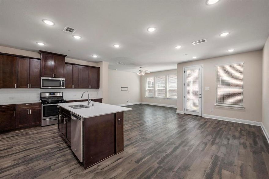 Welcome home to this gorgeous and centrally located home in Allen, TX!  Featuring 4 bedrooms, 3 and a half baths, and over 2,000 square feet of bright open living space.  The downstairs has beautiful luxury vinyl plank flooring, solid wood cabinetry in the kitchen with updated granite counters, a gas range, a spacious pantry, and half bath off of the garage entrance.  Upstairs features four roomy bedrooms each with their own sizeable closet.  The primary bedroom is generous in space with a nice walk in closet, open bathroom with stand up shower, and dual sinks.  The utility room is upstairs for ease of use featuring space for your oversized washer and dryer.  Spacious 2 car garage with extra room for storage.  The backyard is plentiful to entertain those pets or little ones and has a covered patio.  The interior also includes a fire suppression system which helps reduce homeowners insurance costs.  The HOA covers the entirety of the exterior of the home including the roof, foundation, irrigation, etc.  Don't miss out on this great opportunity to live in comfort and style in this amazing home in Allen!