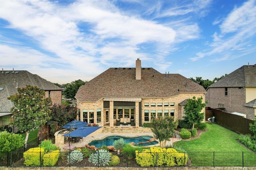 Welcome to luxury living in the prestigious 5-star neighborhood of The Trails of West Frisco! This home stands out due to its unique position, not on a city alley, but featuring a beautiful backyard facing the 14th hole tee box. This traditional 5BR, 4BA, with a dedicated office and flex space off the Primary BR, is perfectly situated on a premier golf course lot, offering breathtaking sunset views that will leave you in awe. Spanning over 5000 square feet, this meticulously designed home boasts an open-concept layout. The gourmet chef’s kitchen features top-of-the-line stainless steel appliances, a spacious island, and custom cabinetry, seamlessly flowing into the expansive living area with a fireplace and ultra tall ceilings. The primary suite, located on the main level, is a true retreat, complete with a spa-inspired ensuite, dual vanities, and walk-in closets. Each additional bedroom is generously sized, with ample natural light, walk-in closets, and access to beautifully appointed bathrooms. The home has automatic roller shades throughout, a large game room with a bar and sink, and a theater for those stay-at-home movie nights! Step outside to your private oasis, where a sparkling pool awaits, perfect for entertaining or relaxing while overlooking the lush fairways of the championship golf course. With a retractable awning, weather will not prevent the good times by the pool! The meticulously landscaped backyard offers ample space for outdoor dining and soaking in those unforgettable sunsets. Home features 2 newer hot water heaters and HVAC systems. The roof is less than 3 years old. Three car garage with high end, insulated garage doors and epoxy flooring. Located in a coveted community with side walks and beautiful trails, top-rated schools, and proximity to fine dining and shopping, this home is the epitome of elegance and comfort. Some of the best schools around right in the neighborhood! Easy to show and move in ready!