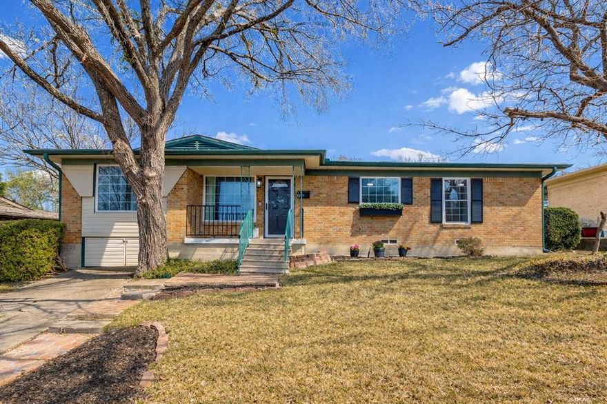Welcome to this bright and inviting home in the vibrant Forest Oaks neighborhood of East Dallas, where natural light, warm hardwood floors, and an open layout create a space that feels both comfortable and full of possibility. The main living, dining, and kitchen areas flow together easily, making everyday living and entertaining feel effortless. Three bedrooms and a full bath are tucked along the south side of the home, offering a sense of privacy from the main living spaces. Just beyond the living room, a spacious flex room adds incredible versatility with plumbing access already in place. This flexible area can easily serve as a second living space, home office, playroom, or guest retreat, with the potential to create a large split primary suite. A rendering showing the space reimagined with an added half bath is available at the transaction desk. Step outside to a large backyard that offers a true blank canvas for outdoor living, gardening, or future landscaping projects. A pergola creates a natural spot for relaxing or entertaining, and the yard is supported by a sprinkler system. A rear carport provides covered parking. Enjoy an unbeatable East Dallas lifestyle just a short walk from Saint Francis Park and only minutes from White Rock Lake, the Dallas Arboretum, Casa Linda Shopping Center, popular dining spots like Smoky Rose, and miles of nearby trail systems. Zoned to Alex Sanger Preparatory.