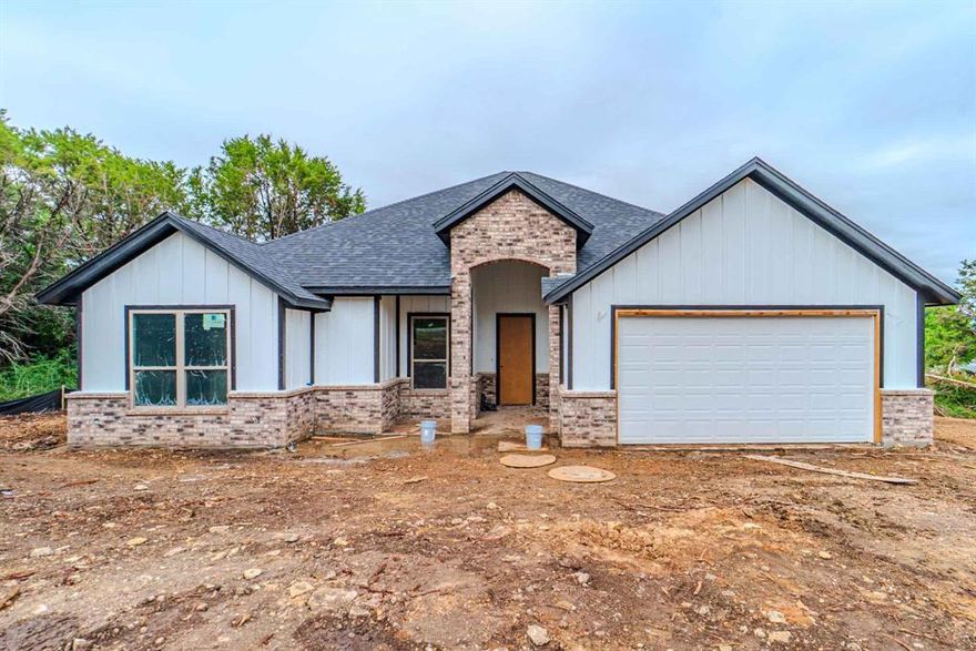 NEW CONSTRUCTION!! Located in a gated lake community. 4 Bedrooms, 2 bath home. This Gem offers modern features, Design, space, and layout. All custom tiled baths, and backsplashes. Custom-made kitchen cabinets and bathroom vanities. Custom-made brick chimney. Double vanity in the master bathroom. Beautiful Quartz countertops throughout the kitchen and bathrooms. This home has a nice and unique open floor concept with a lot of natural lighting, so you can go wild decorating spaces! Home is sitting on a big lot. This home is equipped with energy-saving insulation, with highly efficient HVAC, and WH, perfect for energy saving! Come see this Gem today, while it lasts!