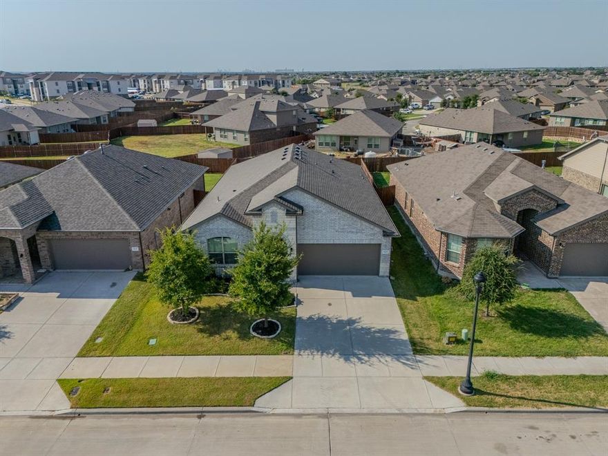 Welcome to this beautifully maintained, move-in-ready single-story home in the highly sought-after Northwest ISD.  Featuring four bedrooms and two baths, this residence offers a thoughtful layout, stylish finishes, and numerous upgrades designed for both comfort and entertaining.  A newly installed Class 3 impact-resistant roof (rated for 110–130 mph winds) provides added durability and peace of mind, complete with a transferable warranty. Additional exterior highlights include a striking stone and brick elevation, custom landscaping, a storm glass front door, and a retractable back patio screen.  Inside, the chef’s kitchen is a standout, featuring quartz countertops, a tiled backsplash, stainless steel appliances including a gas range, upgraded hardware, and elegant cabinet lighting. The oversized island offers generous prep space, while the coffee bar and walk-in pantry add both convenience and charm. The open-concept design flows seamlessly into the dining and living areas, complemented by a tucked-away office nook.  The spacious primary suite features dual quartz vanities, an oversized walk-in shower with built-in seating, a linen closet, and a large walk-in closet. Secondary bedrooms are well-sized, with one offering custom Elfa shelving—perfect for storage or creative use.  Additional features include a functional drop zone off the garage, a large laundry room, Z-Wave thermostat, and overhead garage storage. Residents of Bridgeview enjoy access to walking trails, a community pool, and two playgrounds. This home offers the perfect blend of style, functionality, and community living.