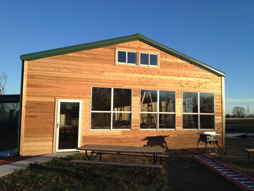 Located just minutes from I-30 off of Hwy 19 S sits this little retreat. 2 acres with Metal Shop with an adorable 900 sq ft apt with butcher block cabinet tops and farm sink. The extended back screened in patio is a perfect bonus to enjoy morning coffee or grill out with friends and family and overlooks a small neighboring lake as well. The building was used as a local winery originally, and numerous peach trees and blueberry bushes are still abundant in the spring. Possibilities are numerous with this gem, as it could be used for income producing entities and has plenty of room to expand. Or make it your dream home. 2 HVAC systems and 400 amp electric, along with a 10 x 10 shop door with room to add more are onsite. Space is very flexible and can be opened up for a large scale expansion, or divided further for boat storage, event venues, restaurant, rental, office, salon, or service entity business home bases to name a few. Your new PLACE awaits just minutes from downtown Sulphur Springs, and on the main highway to dock you boat on LAKE FORK!