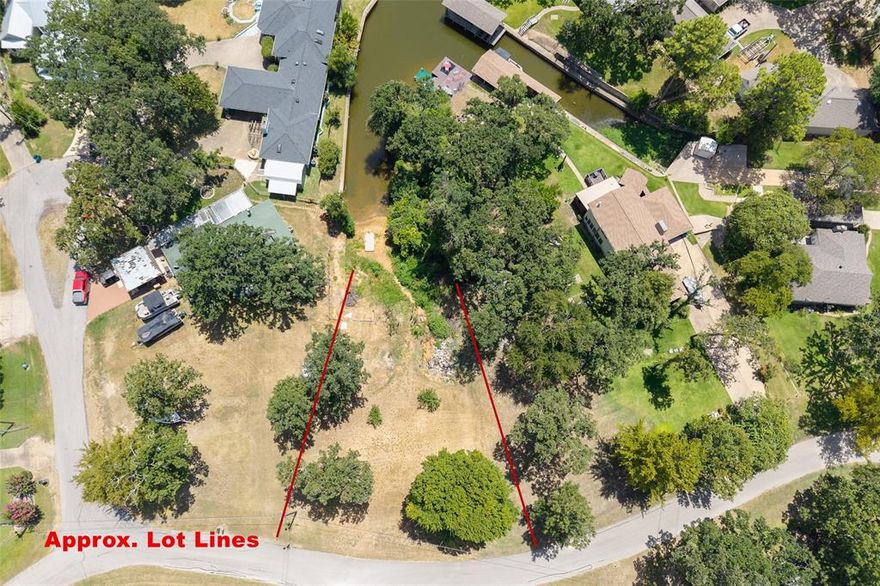 Discover the perfect backdrop for your dream lake retreat in the welcoming community of Paradise Bay. This lot offers views straight down the channel, giving you the ideal setting to design a home where every day feels like vacation.

Paradise Bay residents enjoy two private park areas with boat ramps, shaded pavilions, and picnic spots. Really everything you need for effortless days on the water or relaxed gatherings with friends. Imagine sipping coffee on your future back porch, watching the water shimmer in the morning sun, or winding down evenings with breathtaking lake views.

Conveniently close to shopping and dining yet tucked away for peace and quiet, this property gives you the best of both worlds.

Opportunities like this don’t last—schedule your visit today and take the first step toward creating your lakeside paradise!