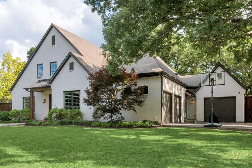 Gorgeous four bedroom, four and a half bath offering sits on an oversized .47 acre lot in the coveted private school corridor and is a perfect family oasis.  The home was designed with significant glass to encounter the large backyard with its impressive tree grove throughout the open floor.  Built in 2014, the home features a master up plan with two additional ensuite beds on the second floor, creating a fantastic living arrangement for connected families.  Downstairs has a junior suite, perfect for providing guests with their own space.  The living spaces provide a private reading nook, living area, dining area and off set playroom featuring both a rockclimbing wall and chalk board wall.  The backyard has a large covered patio, large fire pit area, golf green and expansive backyard area for many activities.  Additionally, the three car garage has extra storage space and an integrated CMU storm shelter.  A must see home in this highly sought after neighborhood.