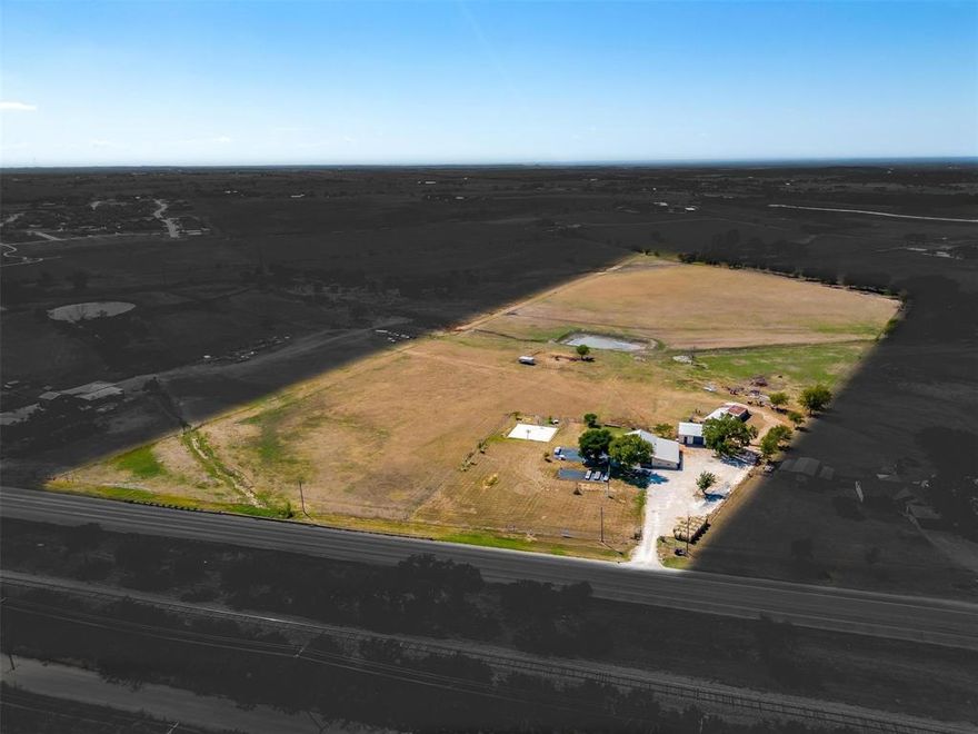 Discover an extraordinary opportunity in Godley, Texas, with this remarkable property offering 20.06 acres of land and a charming ranch-style home. The property is within walking distance to Godley High School and the new football stadium. This versatile land parcel and cozy home offer a blend of convenience and potential that's truly unmatched. This property is perfect for those seeking either commercial or residential use and features 574.88 linear feet of road frontage on Hwy 171. The property is fenced and cross fenced. Huge 40X50 metal shop with electric. The ranch style home features 3 bedrooms, 2 baths and a huge office space that could serve as a fourth bedroom, second living room or game room. Whether you envision a trendy cafe, a professional office space, or any other commercial enterprise, this property offers the versatility to accommodate your business aspirations!